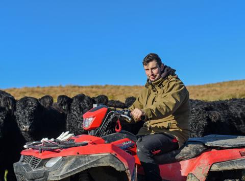 Ben Edmondson of Clerkhill Farm sitting on all terrain vehicle